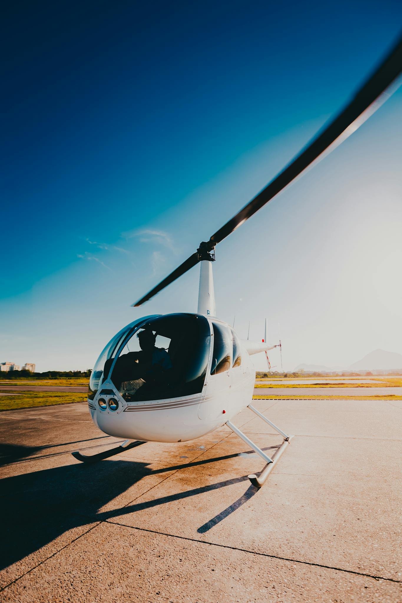 Person Riding White Helicopter