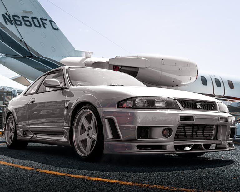 Nissan Skyline and Airplane behind